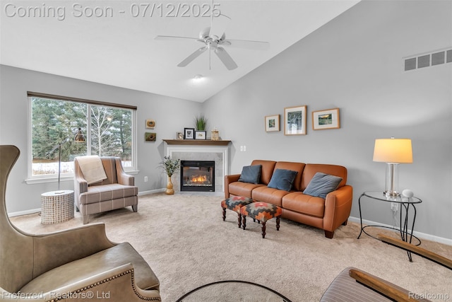 77 Sedum, Howell, MI 48843 - carpeted living room featuring ceiling fan, lofted ceiling, and a tile fireplace