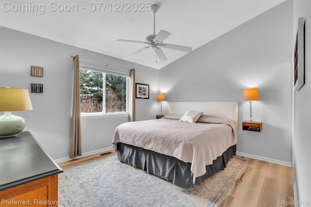 77 Sedum, Howell, MI 48843 - bedroom with light wood-type flooring, vaulted ceiling, and ceiling fan