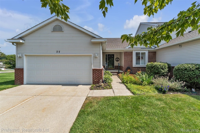 77 Sedum, Howell, MI 48843 - single story home with brick siding, driveway, a front lawn, and a garage