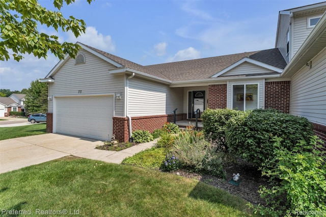 77 Sedum, Howell, MI 48843 - view of front of home with brick siding, a garage, a shingled roof, driveway, and a front yard