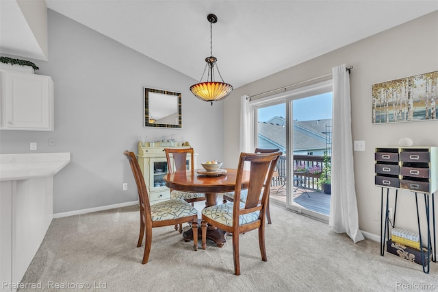 77 Sedum, Howell, MI 48843 - dining space with light colored carpet and vaulted ceiling