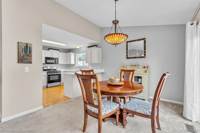 77 Sedum, Howell, MI 48843 - dining area with light carpet and baseboards