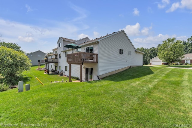 77 Sedum, Howell, MI 48843 - rear view of property with a lawn and a wooden deck