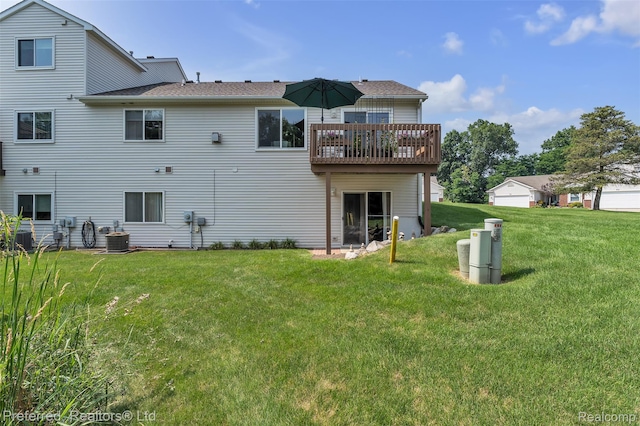 77 Sedum, Howell, MI 48843 - back of house featuring a lawn and a wooden deck