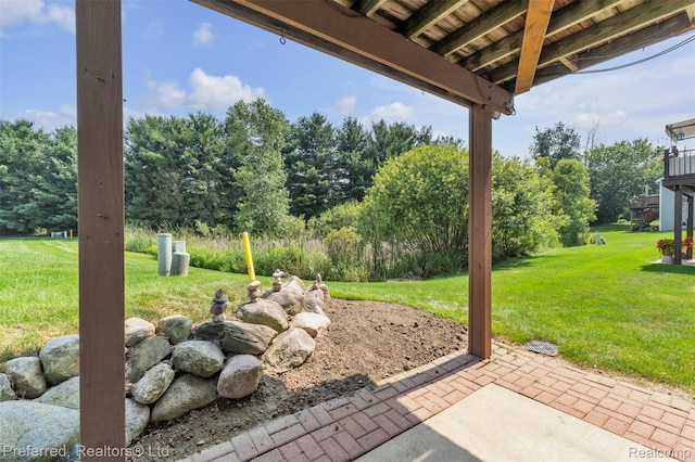 77 Sedum, Howell, MI 48843 - view of patio / terrace featuring view of wooded area