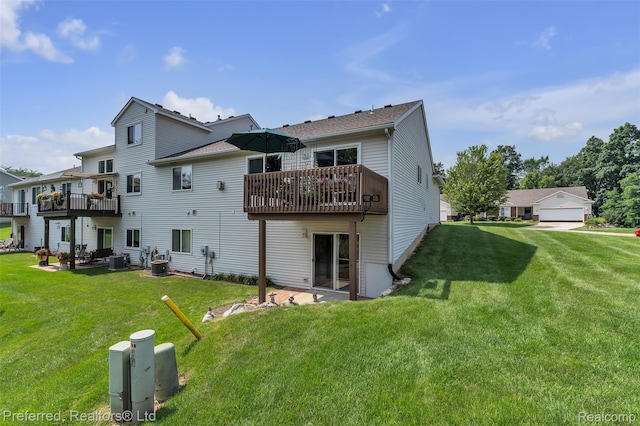 77 Sedum, Howell, MI 48843 - back of property with a lawn and a wooden deck