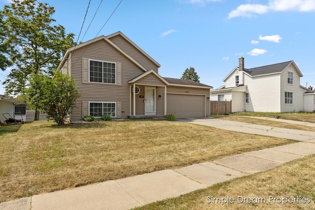 1026 Coldbrook St NE, Grand Rapids, MI 49503 - tri-level home featuring concrete driveway and an attached garage