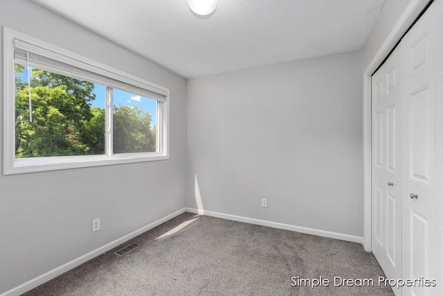 1026 Coldbrook St NE, Grand Rapids, MI 49503 - unfurnished bedroom with carpet and a closet