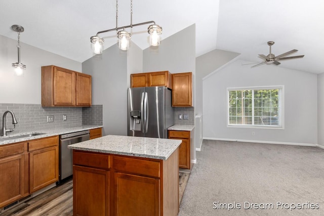 1026 Coldbrook St NE, Grand Rapids, MI 49503 - kitchen with stainless steel appliances, lofted ceiling, ceiling fan, brown cabinetry, and decorative backsplash