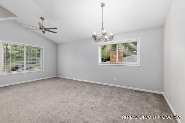 1026 Coldbrook St NE, Grand Rapids, MI 49503 - carpeted empty room with ceiling fan, a chandelier, and vaulted ceiling
