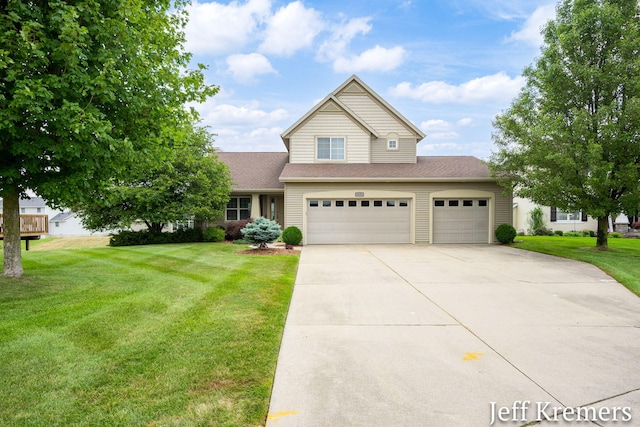 5692 Nile Dr SW, Wyoming, MI 49418 - traditional-style house featuring concrete driveway, a front lawn, a shingled roof, and a garage
