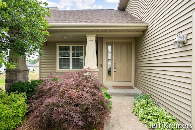 5692 Nile Dr SW, Wyoming, MI 49418 - doorway to property with roof with shingles