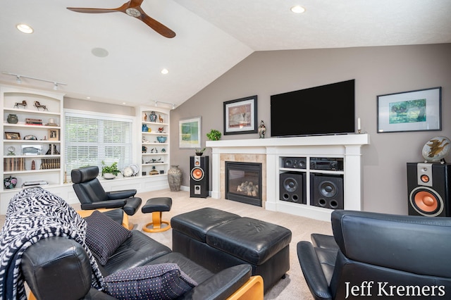 5692 Nile Dr SW, Wyoming, MI 49418 - living area featuring ceiling fan, vaulted ceiling, a tile fireplace, carpet, and recessed lighting