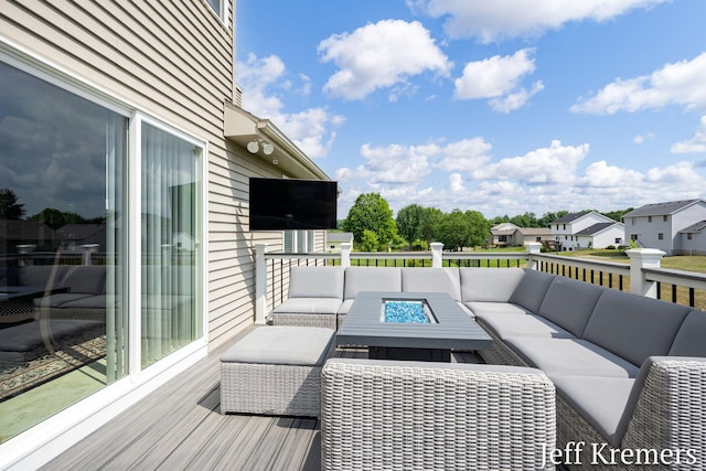 5692 Nile Dr SW, Wyoming, MI 49418 - deck with an outdoor living space with a fire pit and a residential view
