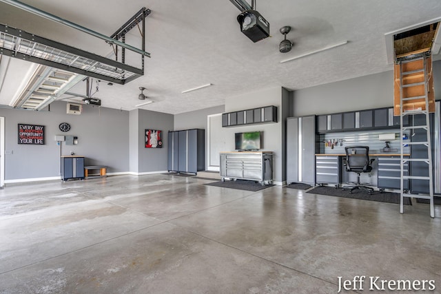 5692 Nile Dr SW, Wyoming, MI 49418 - garage with a garage door opener and baseboards