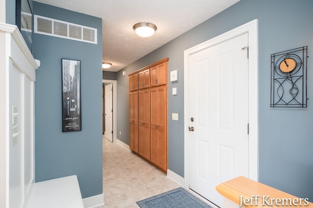 5692 Nile Dr SW, Wyoming, MI 49418 - entrance foyer with baseboards and a textured ceiling