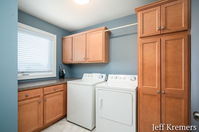 5692 Nile Dr SW, Wyoming, MI 49418 - laundry room featuring cabinet space and washing machine and dryer