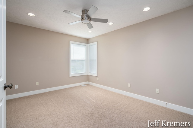 5692 Nile Dr SW, Wyoming, MI 49418 - empty room with recessed lighting, light carpet, and a ceiling fan