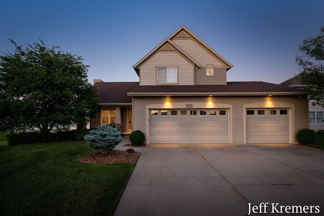 5692 Nile Dr SW, Wyoming, MI 49418 - view of front of house with driveway and a yard
