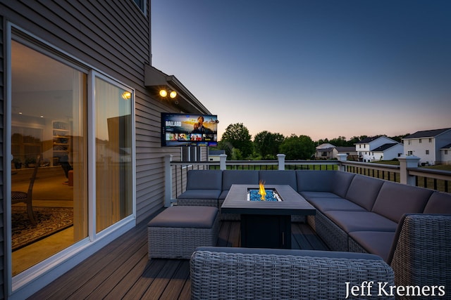 5692 Nile Dr SW, Wyoming, MI 49418 - deck featuring an outdoor living space with a fire pit