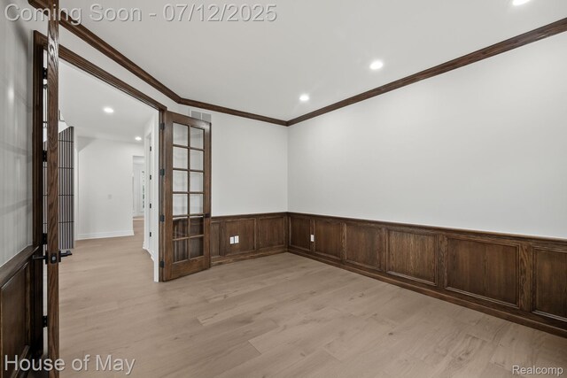 4743 S Ridge Dr, West Bloomfield, MI 48323 - empty room with light wood-style flooring, wainscoting, recessed lighting, ornamental molding, and french doors
