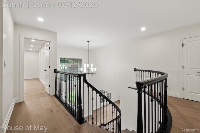 4743 S Ridge Dr, West Bloomfield, MI 48323 - corridor featuring a chandelier, an upstairs landing, wood finished floors, and recessed lighting