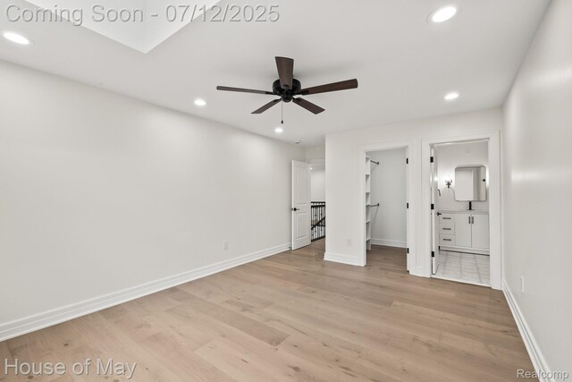 4743 S Ridge Dr, West Bloomfield, MI 48323 - unfurnished bedroom featuring recessed lighting, light wood-type flooring, a walk in closet, and ensuite bath
