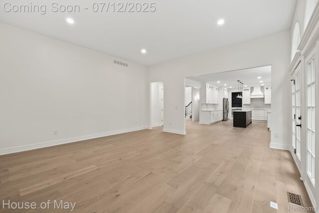 4743 S Ridge Dr, West Bloomfield, MI 48323 - unfurnished living room featuring recessed lighting and light wood-type flooring