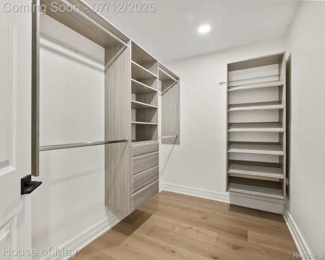 4743 S Ridge Dr, West Bloomfield, MI 48323 - walk in closet featuring light wood finished floors