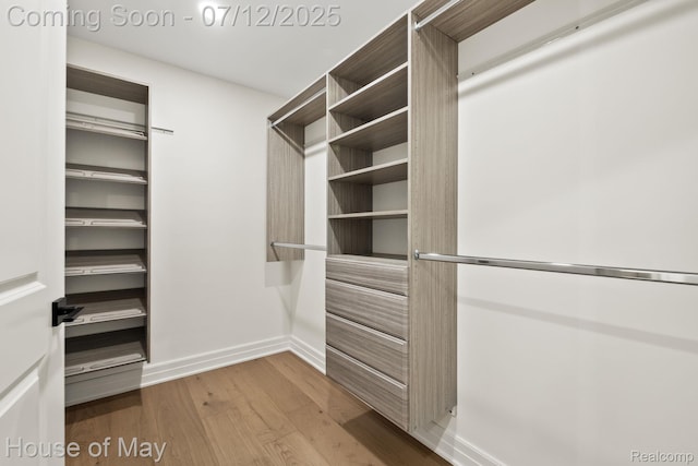 4743 S Ridge Dr, West Bloomfield, MI 48323 - walk in closet with wood finished floors