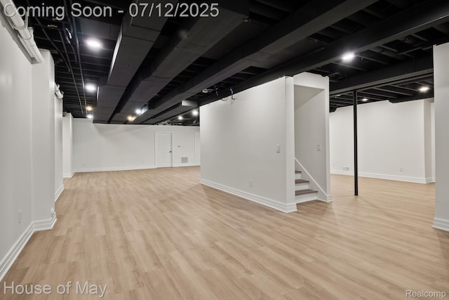 4743 S Ridge Dr, West Bloomfield, MI 48323 - finished below grade area featuring wood finished floors and stairway