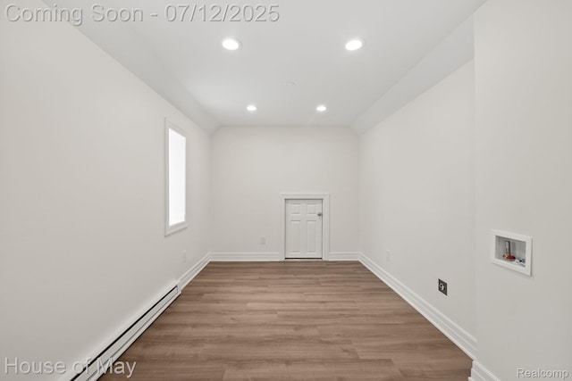 4743 S Ridge Dr, West Bloomfield, MI 48323 - washroom with washer hookup, a baseboard heating unit, recessed lighting, and wood finished floors