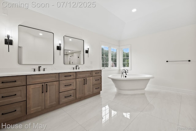 4743 S Ridge Dr, West Bloomfield, MI 48323 - bathroom featuring double vanity, tile patterned floors, a freestanding bath, and recessed lighting