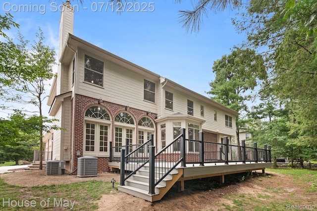 4743 S Ridge Dr, West Bloomfield, MI 48323 - back of house with a deck, brick siding, and a chimney