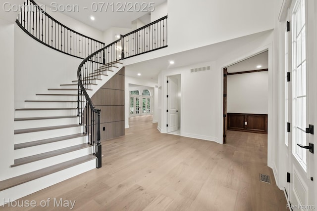 4743 S Ridge Dr, West Bloomfield, MI 48323 - foyer entrance featuring a towering ceiling, wood finished floors, stairs, and recessed lighting