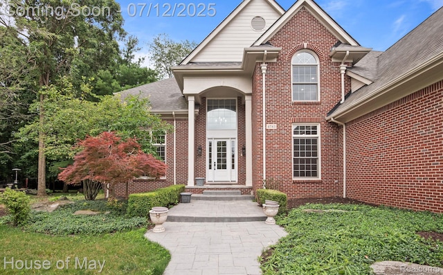 4743 S Ridge Dr, West Bloomfield, MI 48323 - doorway to property featuring brick siding and a shingled roof