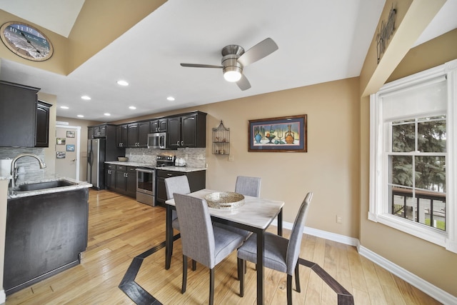 11259 Baker Rd, Jerome, MI 49249 - dining space featuring ceiling fan, plenty of natural light, light wood-style floors, and recessed lighting