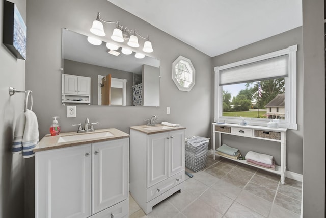 11259 Baker Rd, Jerome, MI 49249 - full bathroom with two vanities and tile patterned flooring