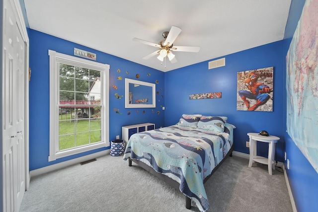 11259 Baker Rd, Jerome, MI 49249 - bedroom with carpet floors, a closet, and ceiling fan