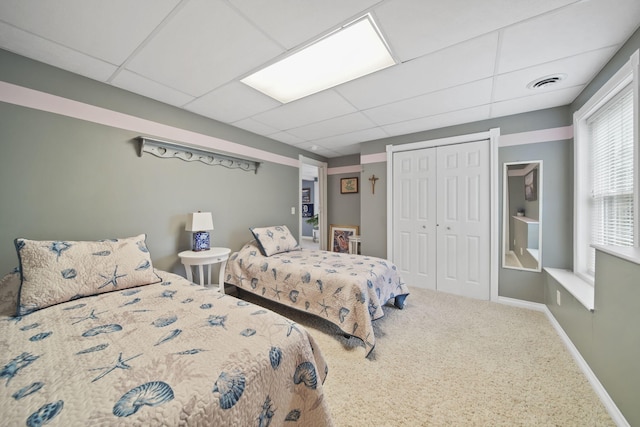 11259 Baker Rd, Jerome, MI 49249 - bedroom with a paneled ceiling, a closet, and carpet flooring