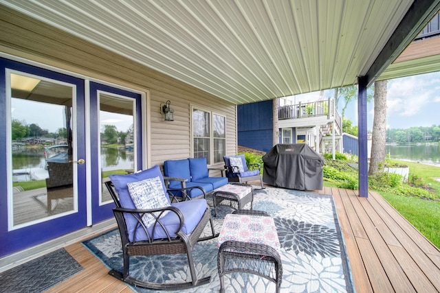 11259 Baker Rd, Jerome, MI 49249 - wooden deck featuring grilling area, a water view, and an outdoor living space