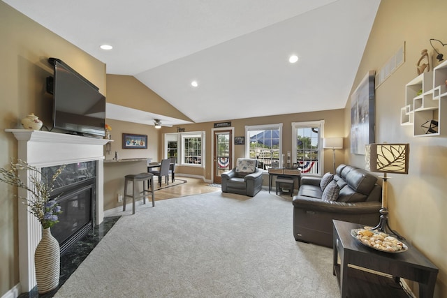 11259 Baker Rd, Jerome, MI 49249 - carpeted living room featuring recessed lighting, a fireplace, high vaulted ceiling, and ceiling fan