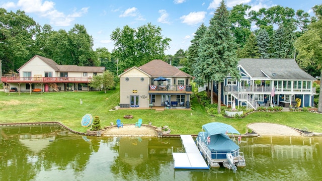 11259 Baker Rd, Jerome, MI 49249 - rear view of property with a yard, a deck with water view, a patio area, and boat lift
