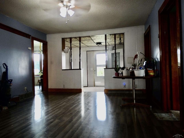 1570 Evon Rd, Saginaw, MI 48601 - unfurnished living room featuring a ceiling fan, wood finished floors, and a textured ceiling