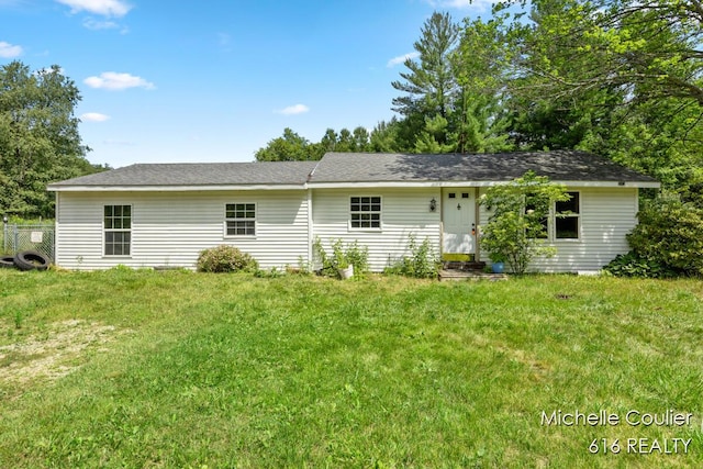 9583 E 5 Mile Rd, Big Rapids, MI 49307 - back of house featuring a lawn