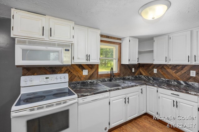 9583 E 5 Mile Rd, Big Rapids, MI 49307 - kitchen with white appliances, open shelves, white cabinetry, wood finished floors, and a textured ceiling