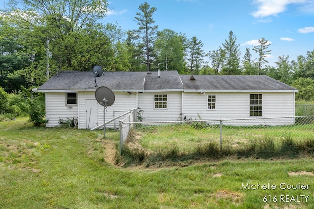 9583 E 5 Mile Rd, Big Rapids, MI 49307 - back of property with a shingled roof