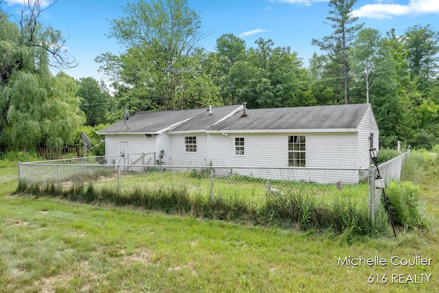 9583 E 5 Mile Rd, Big Rapids, MI 49307 - rear view of property featuring a shingled roof