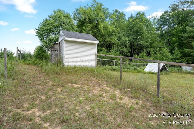 9583 E 5 Mile Rd, Big Rapids, MI 49307 - view of yard with a storage unit
