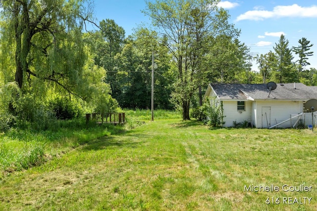 9583 E 5 Mile Rd, Big Rapids, MI 49307 - view of grassy yard